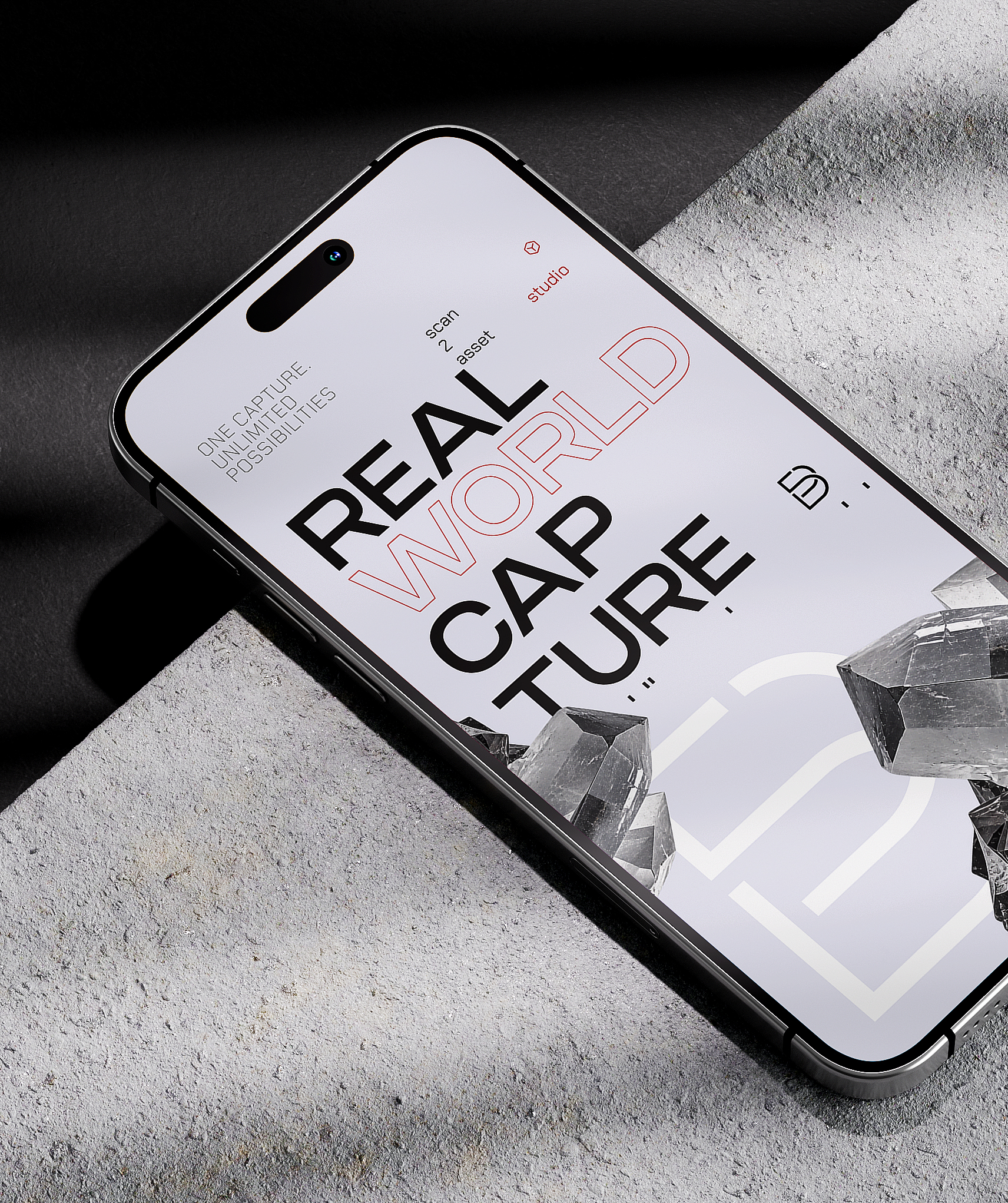 A phone on grey stone showing the Batchfive “Real World Capture” screen with clear crystals