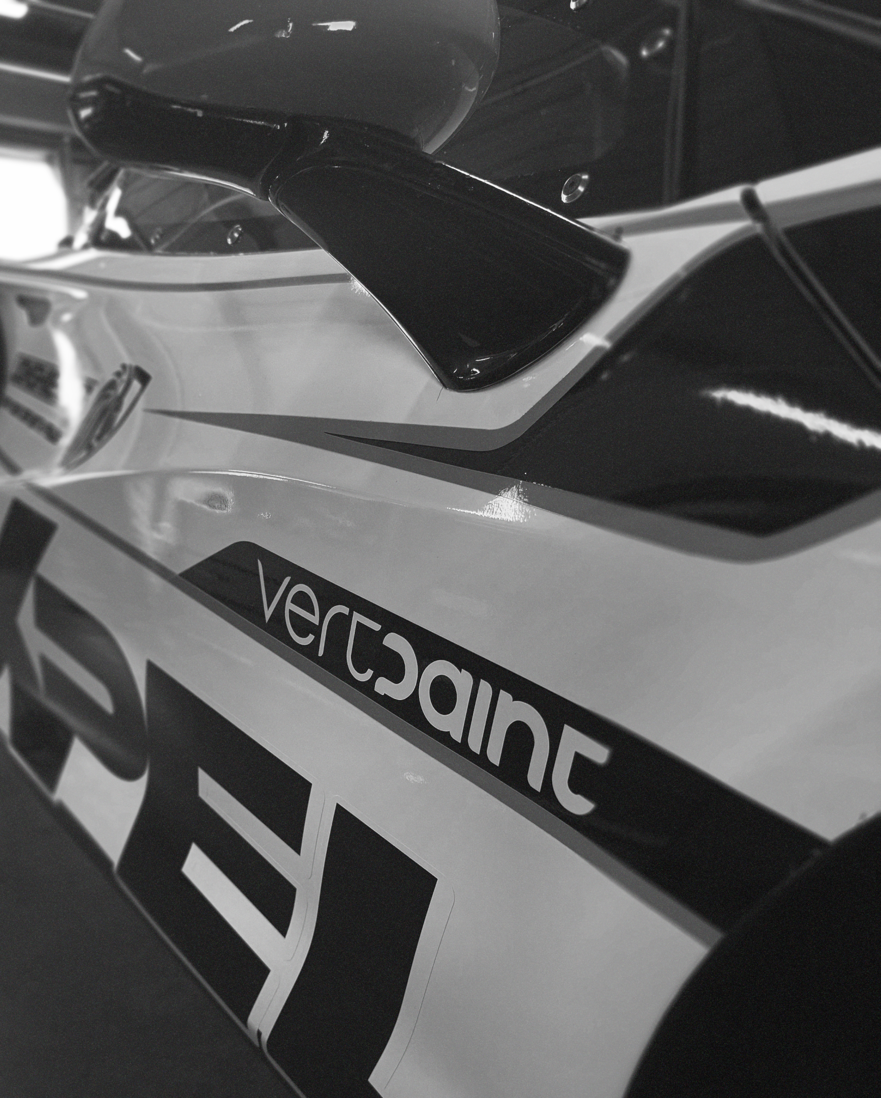 The Vertpaint wordmark on the side of a McLaren 720S GT3 Evo racing in British GT